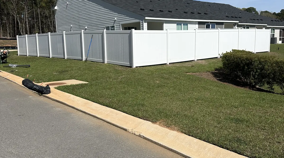 Privacy fence comparison in Orangeburg SC - wood fence and vinyl fence side by side